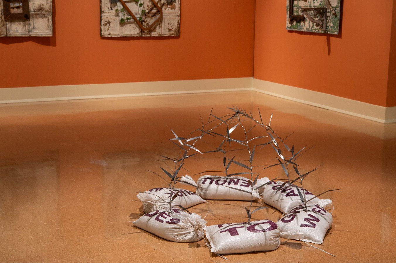 Connor Frew (born 1995), Garden Pavilion (Cutgrass), 2025; Installation view; Sandbags, laser-cut steel, screenprints